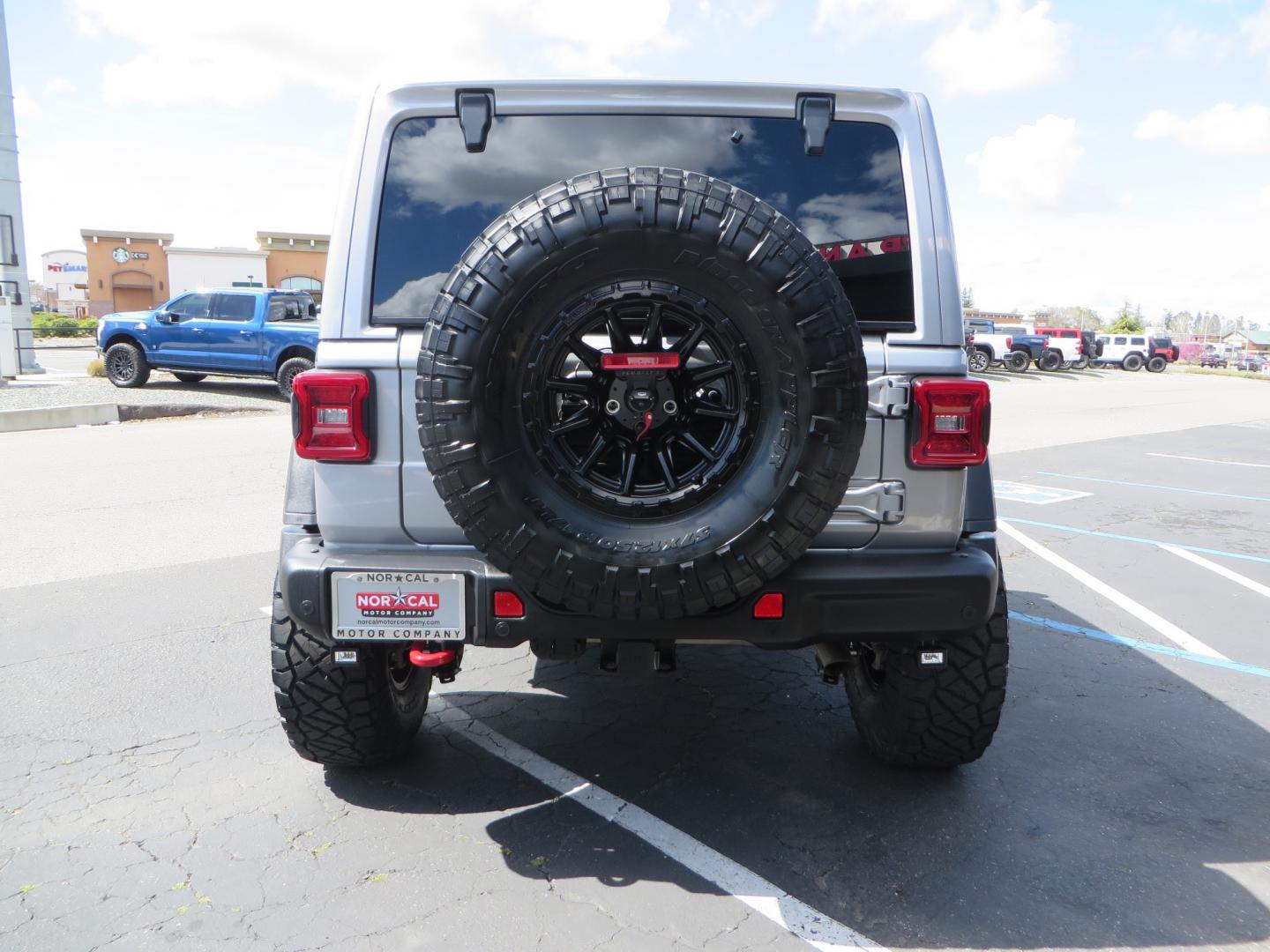 2021 SILVER /BLACK Jeep Wrangler Unlimited Rubicon (1C4HJXFG7MW) with an 3.6L V6 DOHC 24V FFV engine, 6A transmission, located at 2630 Grass Valley Highway, Auburn, CA, 95603, (530) 508-5100, 38.937893, -121.095482 - Features - Zone Offroad 3" Lift kit, Fox shocks, 37" Nitto Ridge Grappler tires, 17" Fuel Piston wheels, Warn winch, KC led lights, Voswitch switches, Teraflex HD tire relocation, Fire extinguisher, High Lift Jack, Shovel, Axe, Jumper Cables, and flat towable. - Photo#5